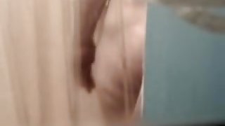 Fem butt and crotch reflected in the shower mirror spied